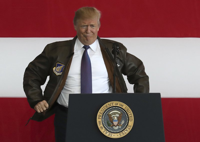 Image result for US President Donald Trump gestures after addressing members of US military services at US Yokota Air Base in Japan, on November 5, 2017