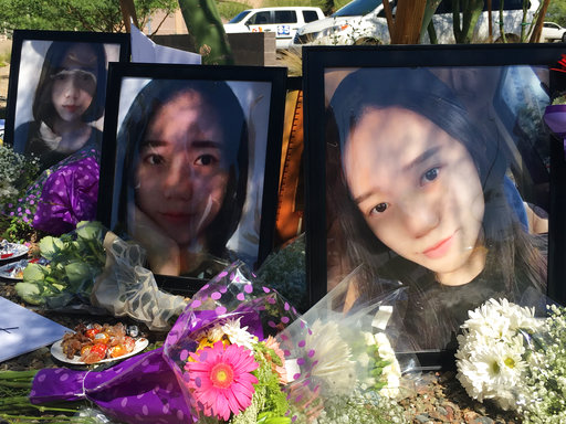 Yue Jiang is shown in large photographs at a memorial over two years after her death in Tempe, Ariz. An Arizona woman who fatally shot the Chinese college student after a car crash was sentenced to 25 years in prison on Friday, June 15.  [Photo: AP]