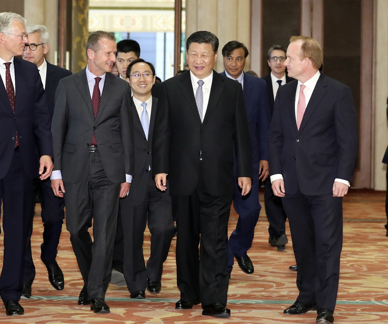 Chinese President Xi Jinping meets with executives of some famous multinational enterprises, who are in Beijing to attend a special session of round-table summit of Global CEO Council, on Thursday, June 21, 2018. [Photo: Xinhua]