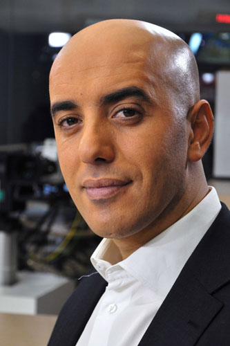 In this photo dated Nov. 22, 2010, notorious French criminal Redoine Faid poses prior to an interview with French all-news TV channel, LCI, as he was promoting his book, in Boulogne-Billancourt, outside Paris, France. Faid serving 25 years for murder made an audacious escape from prison Sunday after a helicopter carrying several heavily armed commandos landed in a courtyard, freed him from a visiting room and carried him away. [File photo: IBO/Sipa via AP]