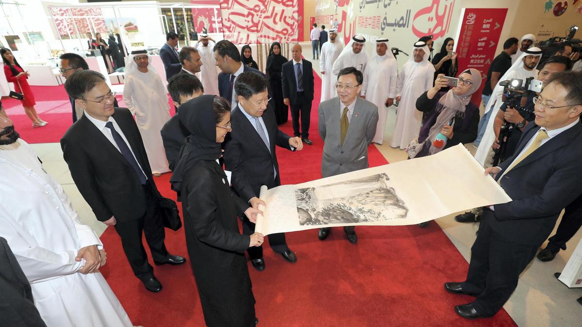 A week celebrating Chinese culture has begun in the UAE in the lead up to Chinese President Xi Jinping's state visit on Thursday. Noura Al Kaabi, the UAE's Minister of Culture and Knowledge Development, was presented on Sunday with a scroll by Chinese official Wang Xiaohui on Sunday Chris Whiteoak / The National