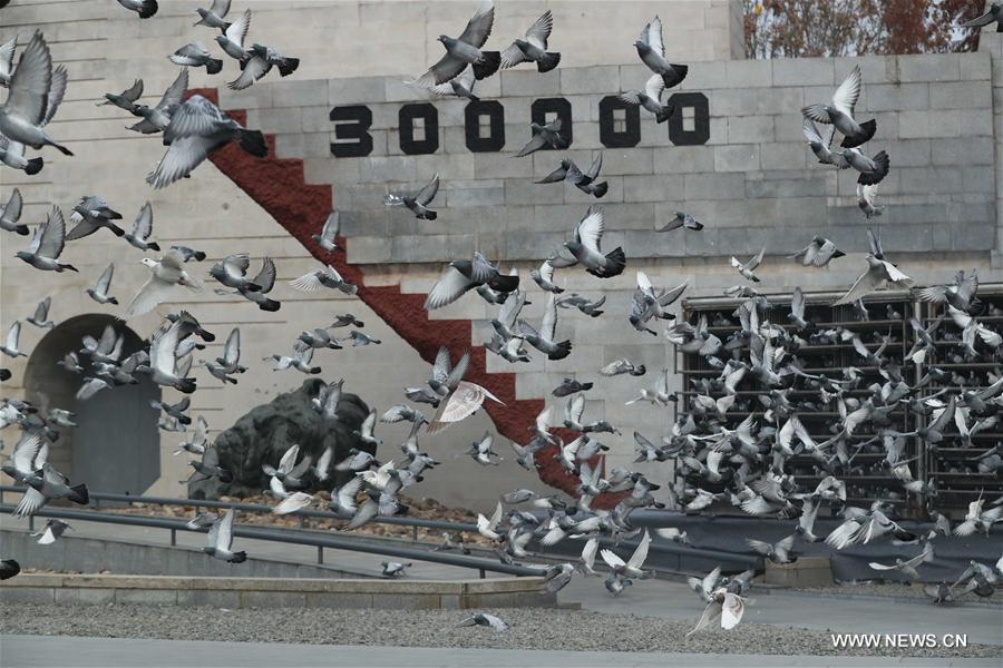 Photo taken on December 13, 2017 shows doves flying on China's National Memorial Day for Nanjing Massacre Victims at the memorial in Nanjing, Jiangsu Province. [File photo: Xinhua]