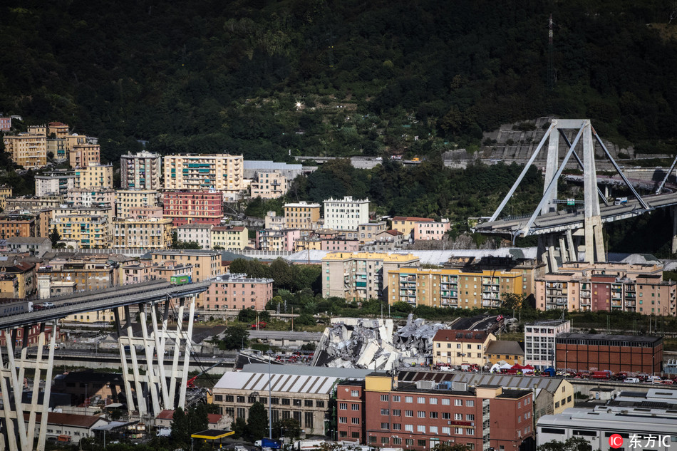 A general view of the Morandi bridge which collapsed on August 14, 2018 in Genoa, Italy. At at least 22 people have died when a large section of Morandi bridge built in the 1960s and part of the A10 motorway suddenly collapsed during a fierce storm sending vehicles falling up to 90m to the ground. [Photo: IC]