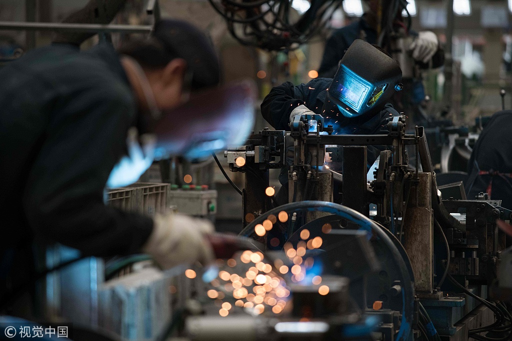 Workers weld SUV parts at the BAIC (Beijing Automotive Group Co) SUV assembly line in Beijing on August 29, 2018. [File photo: VCG/Nicolas Asfouri]