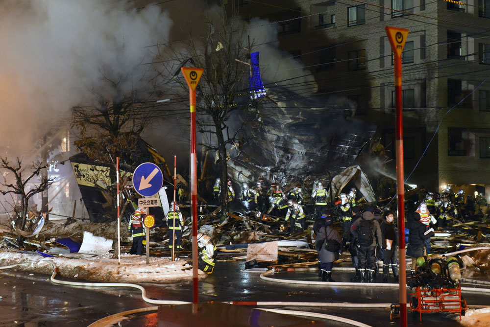 Firefighters work on site where a large explosion occurred at a restaurant in Sapporo, Japan, 16 December 2018. [Photo: IC]