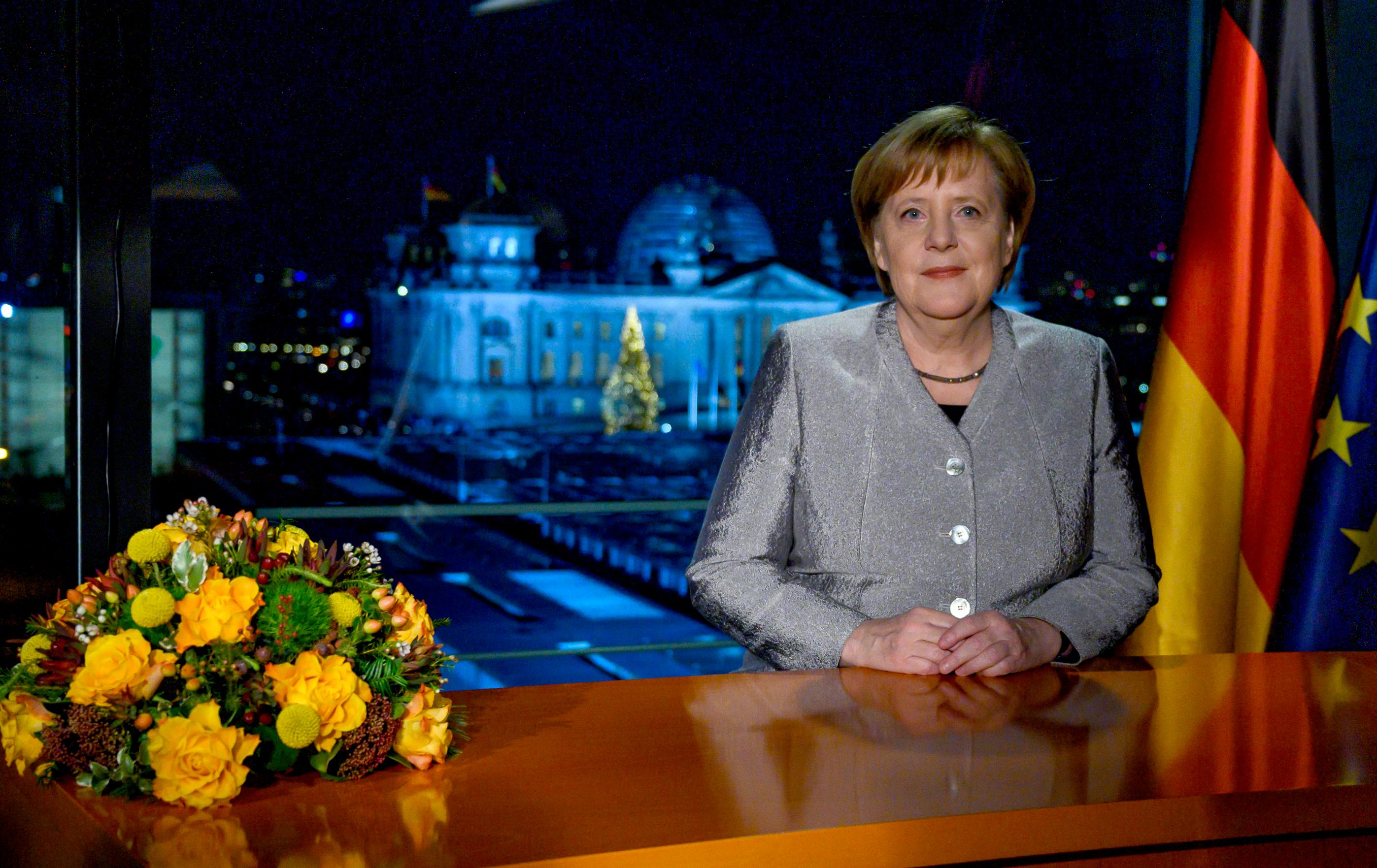 German Chancellor Angela Merkel poses for a photograph after the recording of her annual New Year's speech at the Chancellery in Berlin, Germany, Dec. 30, 2018. [Photo: John MacDougall/ via AP]