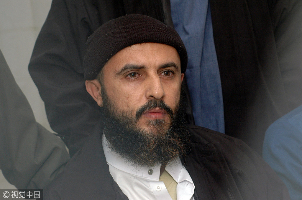 Yemeni convict Jamal al-Badawi listens to the verdict being announced from behind the bars in a Sanaa appeals court, February 26, 2005. [File photo: VCG]
