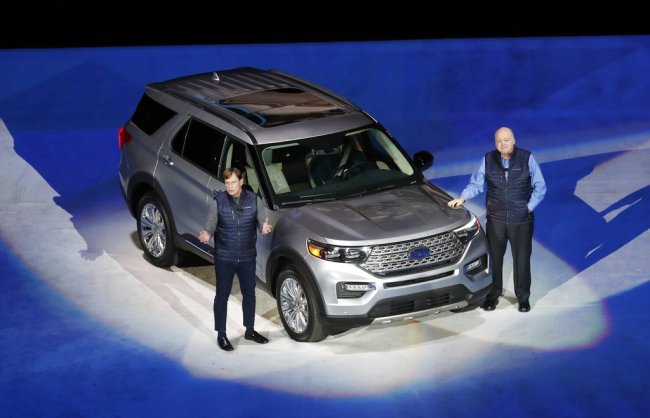 Ford Motor Co., President, Global Markets Jim Farley, left, and President and CEO Jim Hackett stand next to the redesigned 2020 Ford Explorer during its unveiling, Wednesday, Jan. 9, 2019, in Detroit. [Photo: AP]