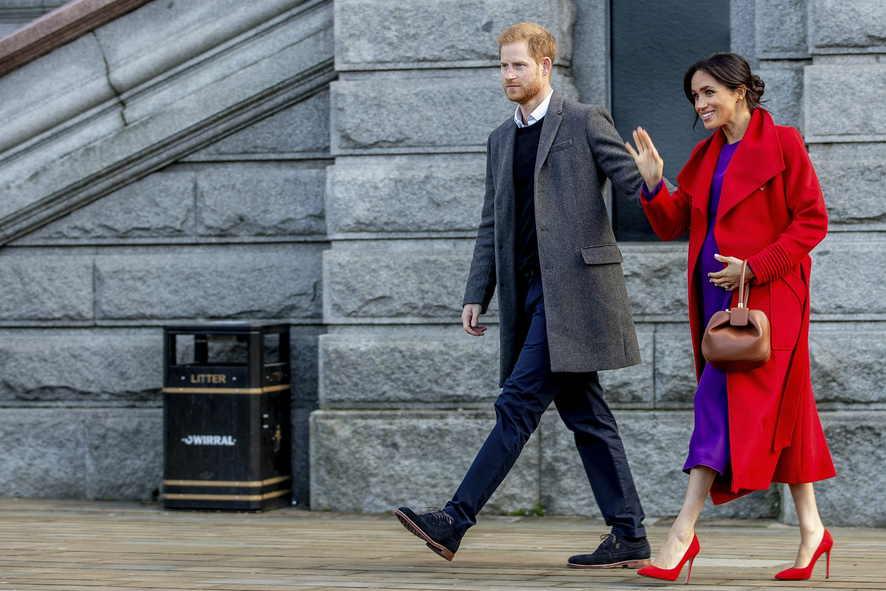 Britain's Prince Harry and Meghan, Duchess of Sussex greet the crowds of people during a visit to Birkenhead, northwest England, Monday Jan. 14, 2019. [Photo: AP]