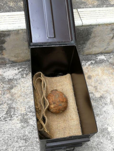 A World War I-era hand grenade is found in a shipment of potatoes from France on February 2, 2019. [Screenshot: China Plus]