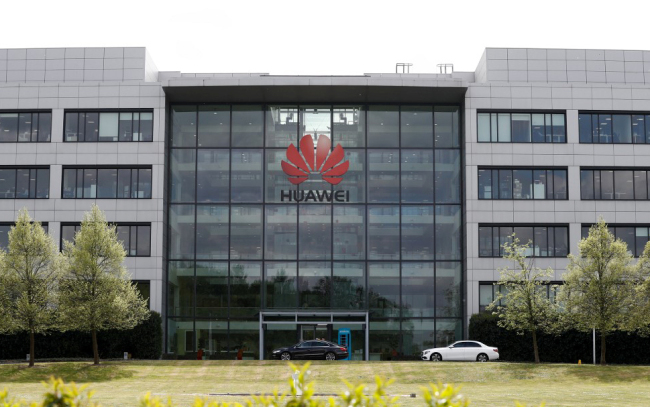 The Huawei logo and signage at their main UK offices in Reading, west of London, on April 29, 2019. [Photo: AFP]