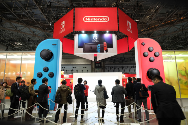 People line up for Nintendo's new Switch game console during a presentation in Tokyo on January 13, 2017. [File Photo: AFP/Kazuhiro Nogi]